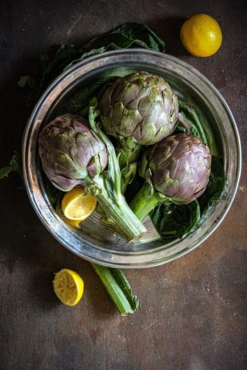 Artichokes in a Stainless Steel Bowl