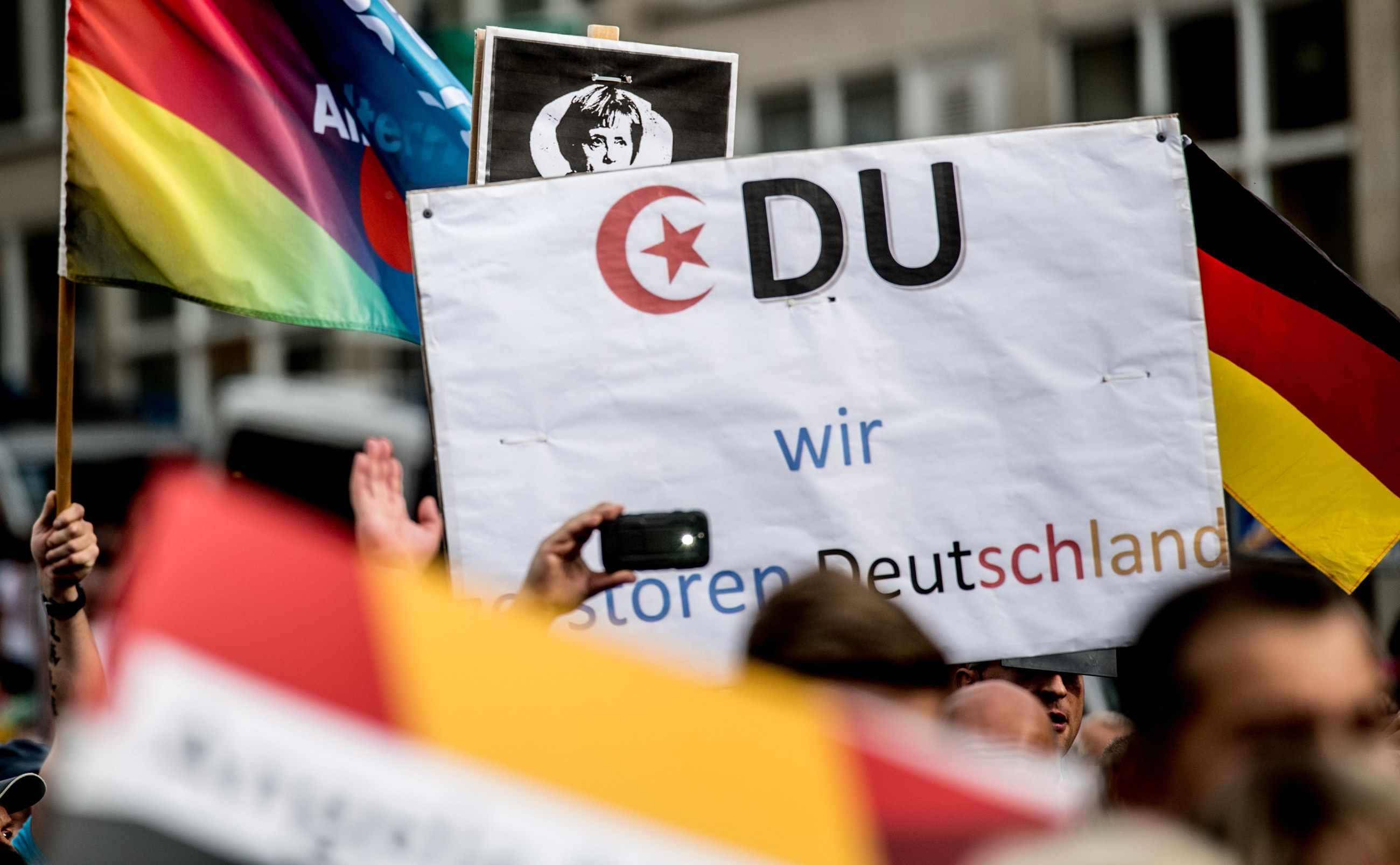 Protest na wiecu wyborczym Angeli Merkel