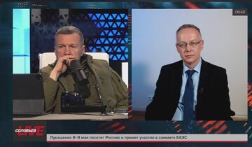 Rosyjski propagandysta Władimir Sołowjow i sędzia Tomasz Szmydt