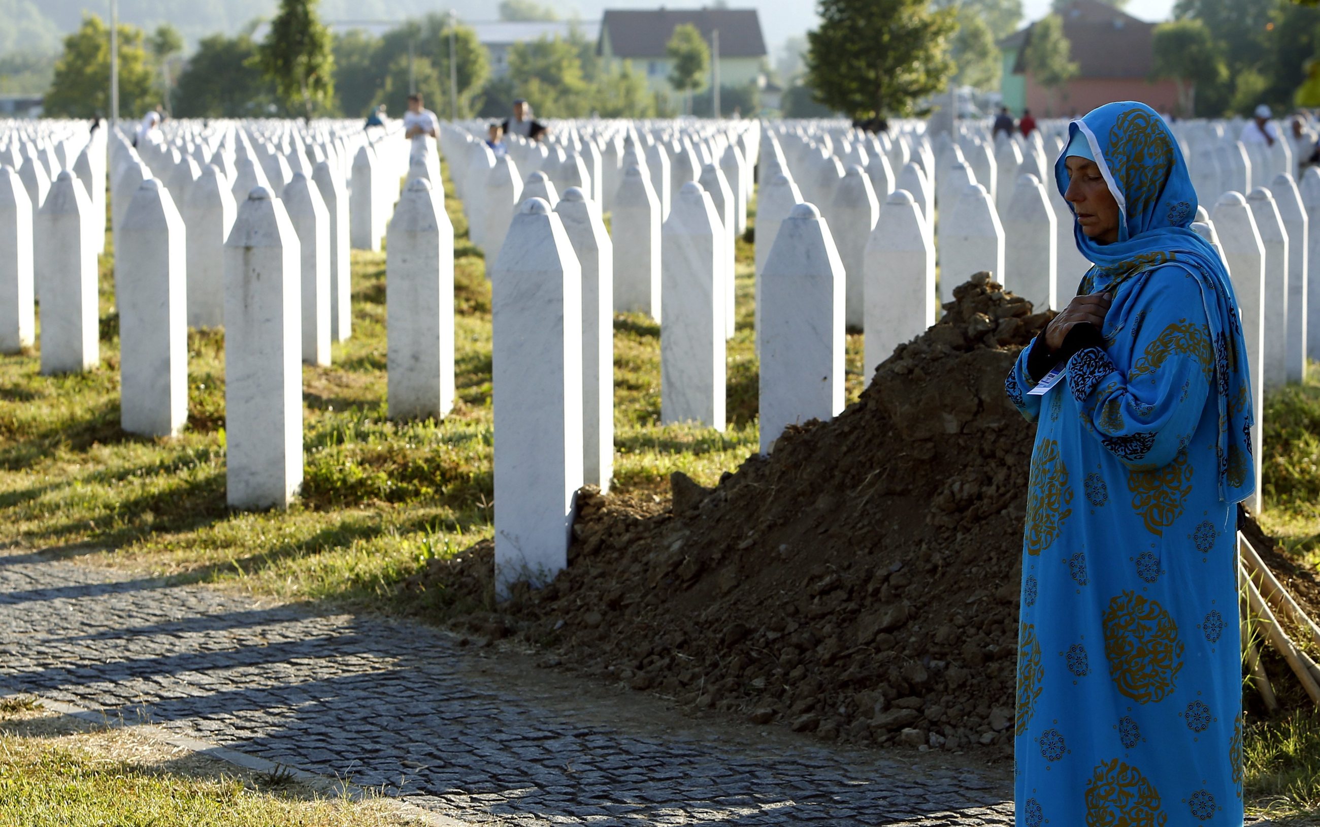 A Bosnian Muslim women cries during the funeral in the Potocari Memorial Center
